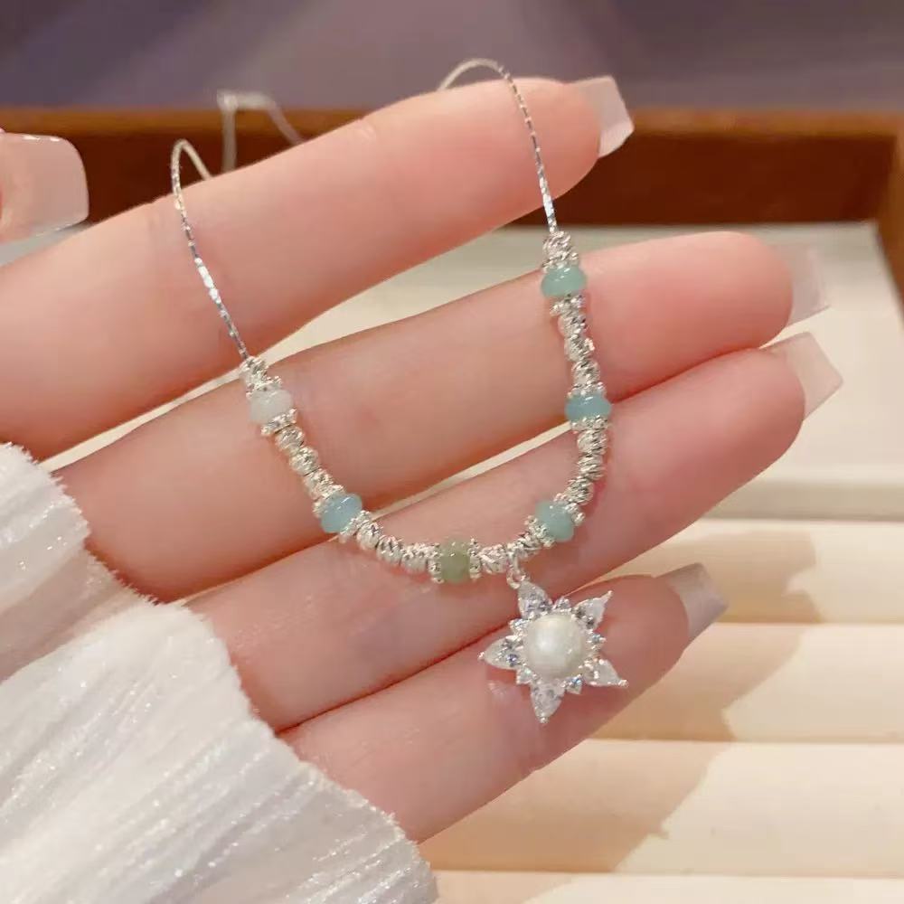 Chic, minimalist, and stylish chunky silver beaded star necklace for women—a fresh, elegant, and trendy piece designed to sit at the collarbone.